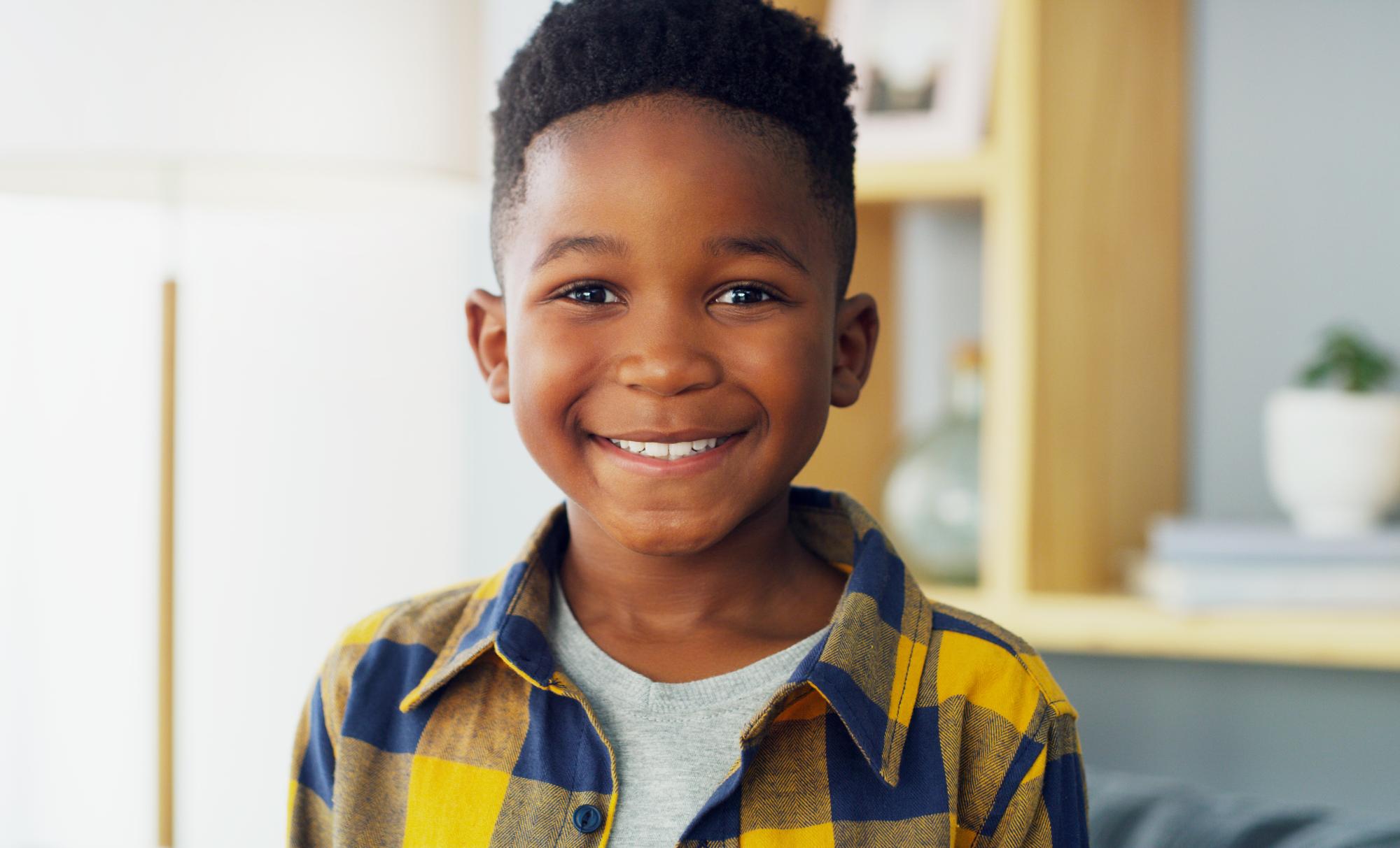 Young boy smiling with a healthy smile