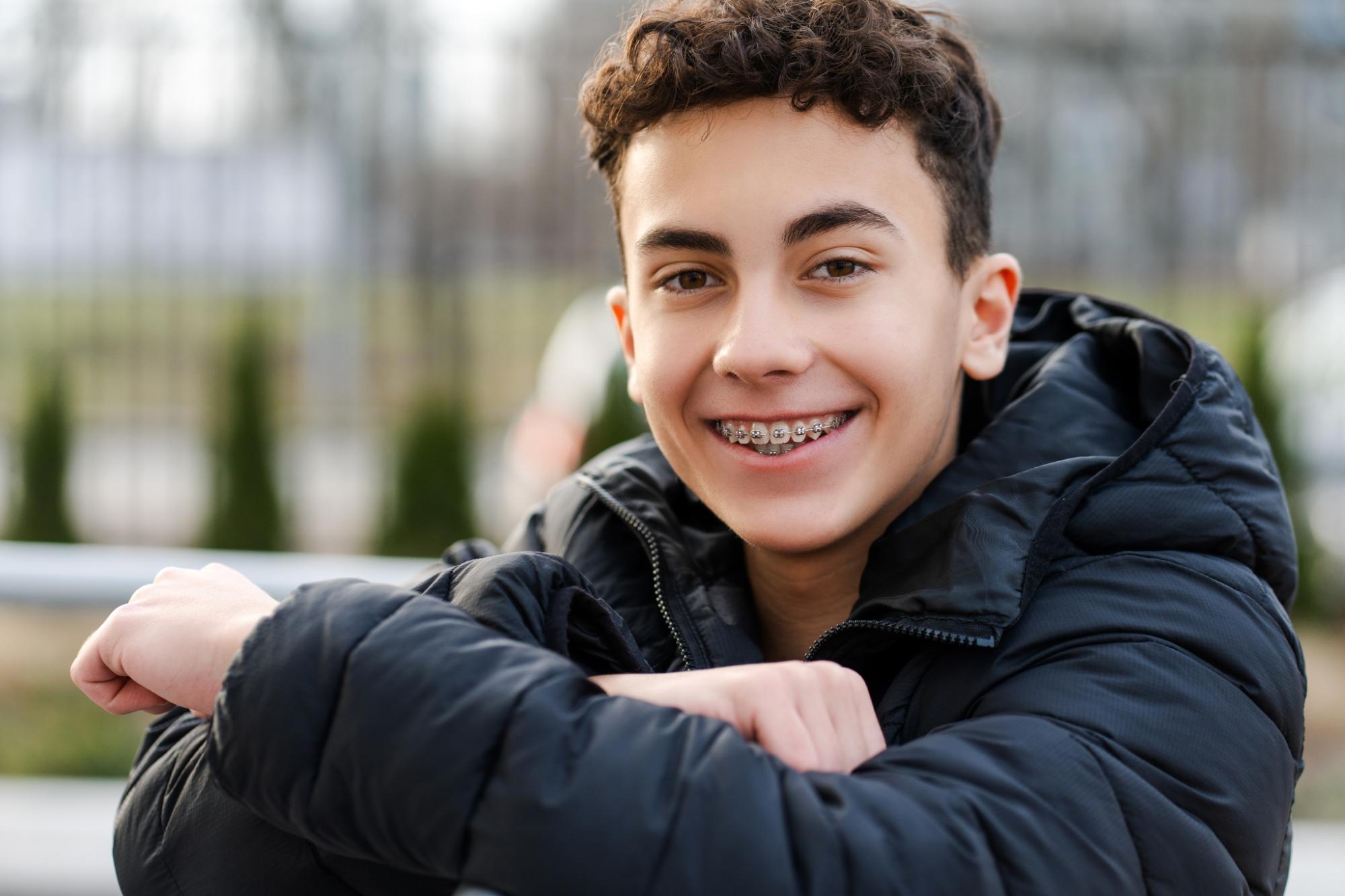 Teen orthodontic patient smiling